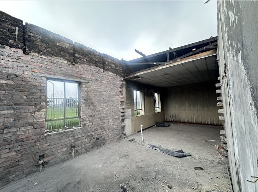 Fire-damaged interior at Vanguard Community Clinic before restoration